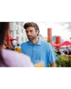 A man having a drink while wearing an Atlas Cutter & Buck Virtue Eco Pique Recycled Mens Polo Thumbnail Image