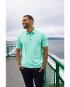 Man posing  by water while wearing Fresh Mint Heather Cutter & Buck Forge Eco Stretch Recycled Mens Polo Thumbnail Image