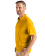 Side profile view of a man wearing a College Gold Cutter & Buck Coastline Epic Comfort Eco Recycled Mens Polo