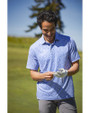 Man standing on a golf course while wearing a Chelan Cutter & Buck Pike Eco Flora Print Recycled Mens Big & Tall Polo