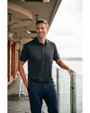 Man standing on a balcony while wearing a Black Cutter & Buck Prospect Eco Textured Stretch Recycled Mens Short Sleeve Polo