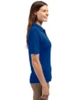 Side profile of a woman wearing a Tour Blue Cutter & Buck Virtue Eco Pique Recycled Womens Polo