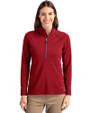 Front profile of a woman wearing a Cardinal Red Cutter & Buck Adapt Eco Knit Stretch Recycled Womens Half Zip Pullover