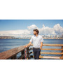 Man standing outdoors while wearing a White Cutter & Buck Virtue Eco Pique Recycled Mens Big and Tall Polo