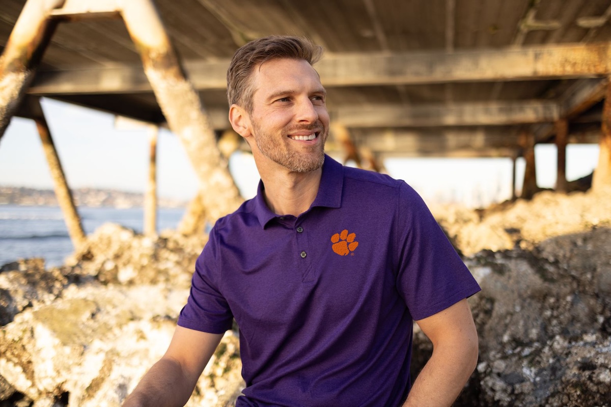 A man wearing a Clemson Tigers Cutter & Buck polo