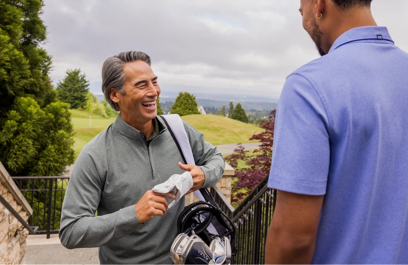 men talking at a golf course