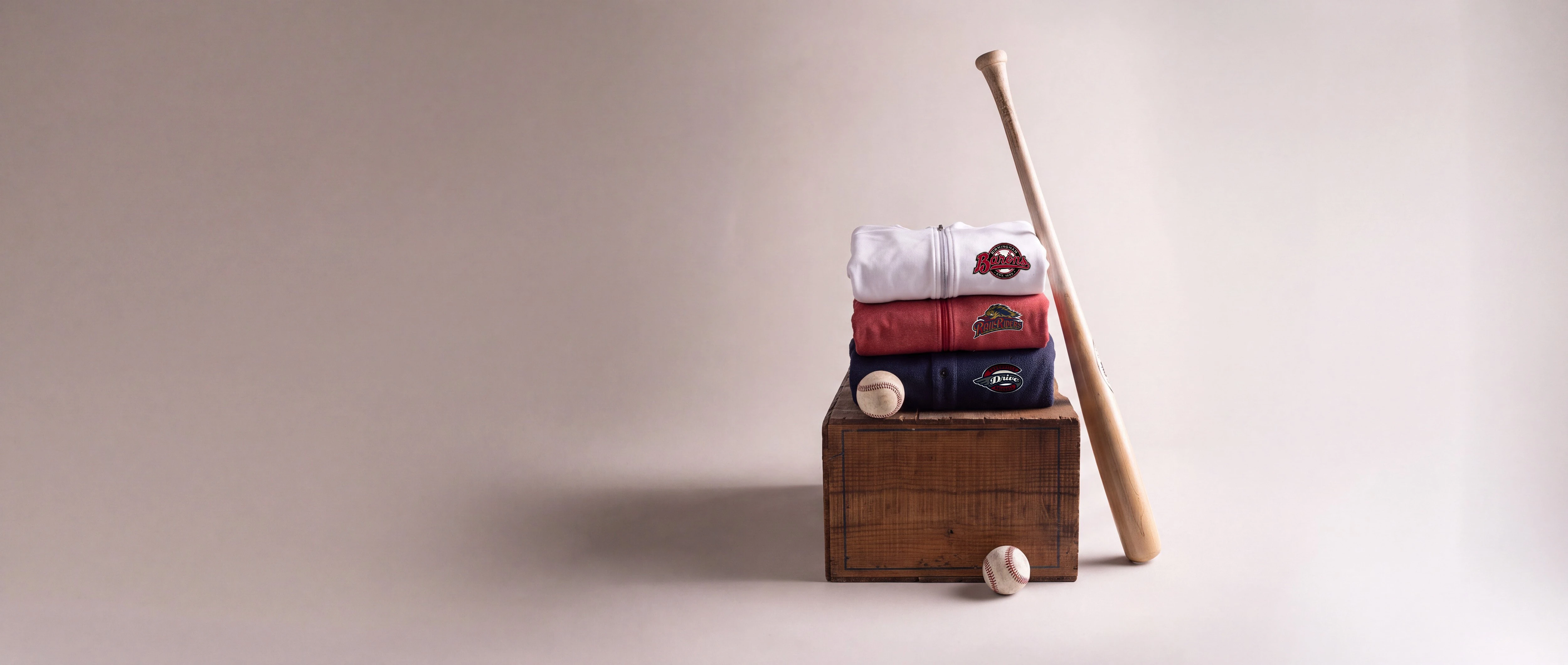 MiLB Branded clothing on wood block