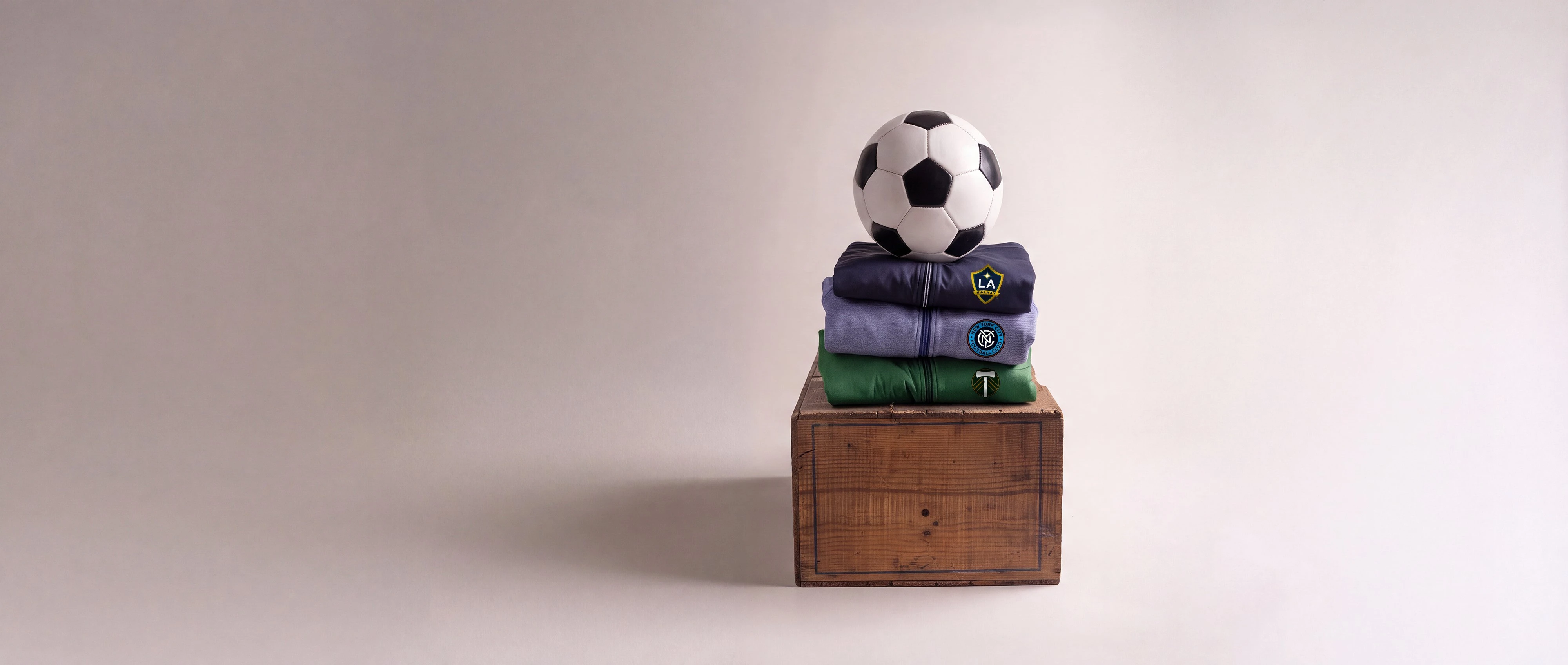 MLS Branded clothing on wood block