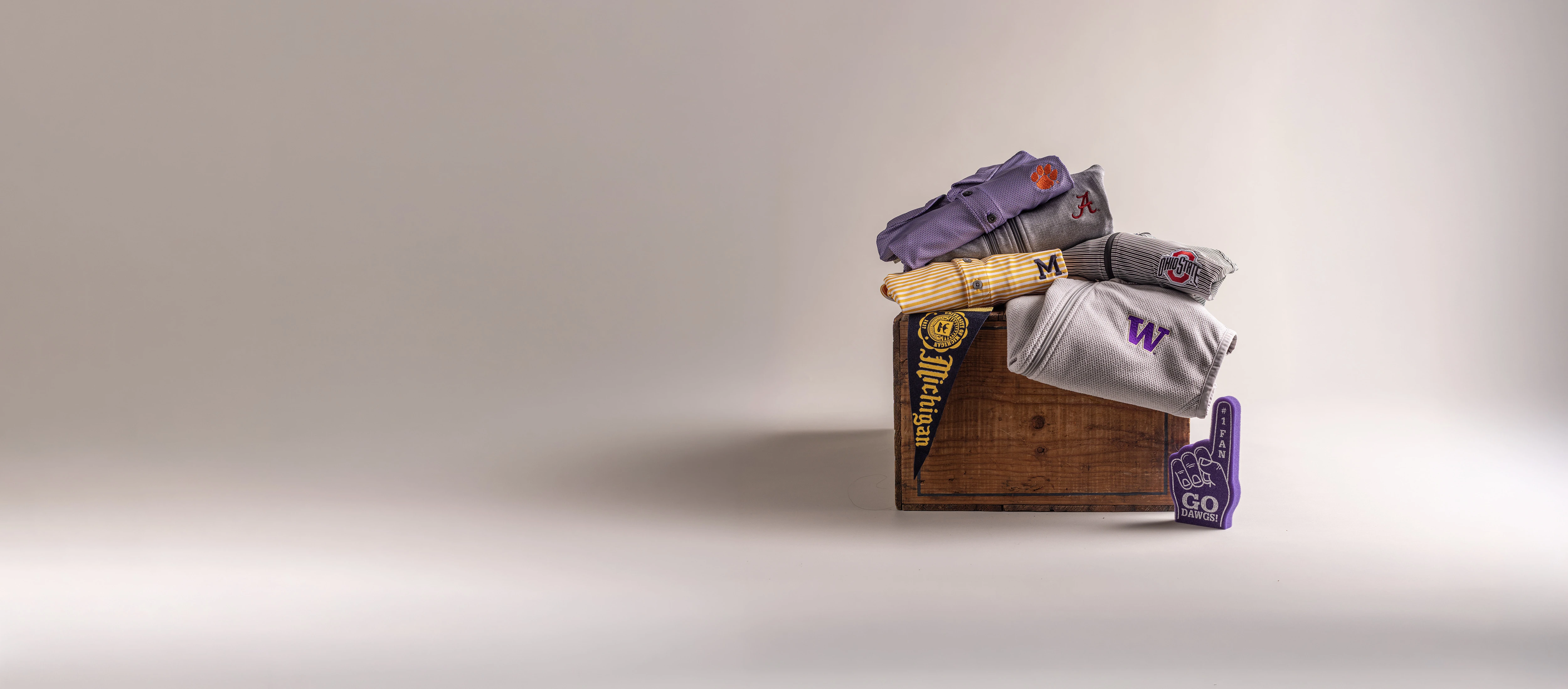 NCAA branded clothing on wood block