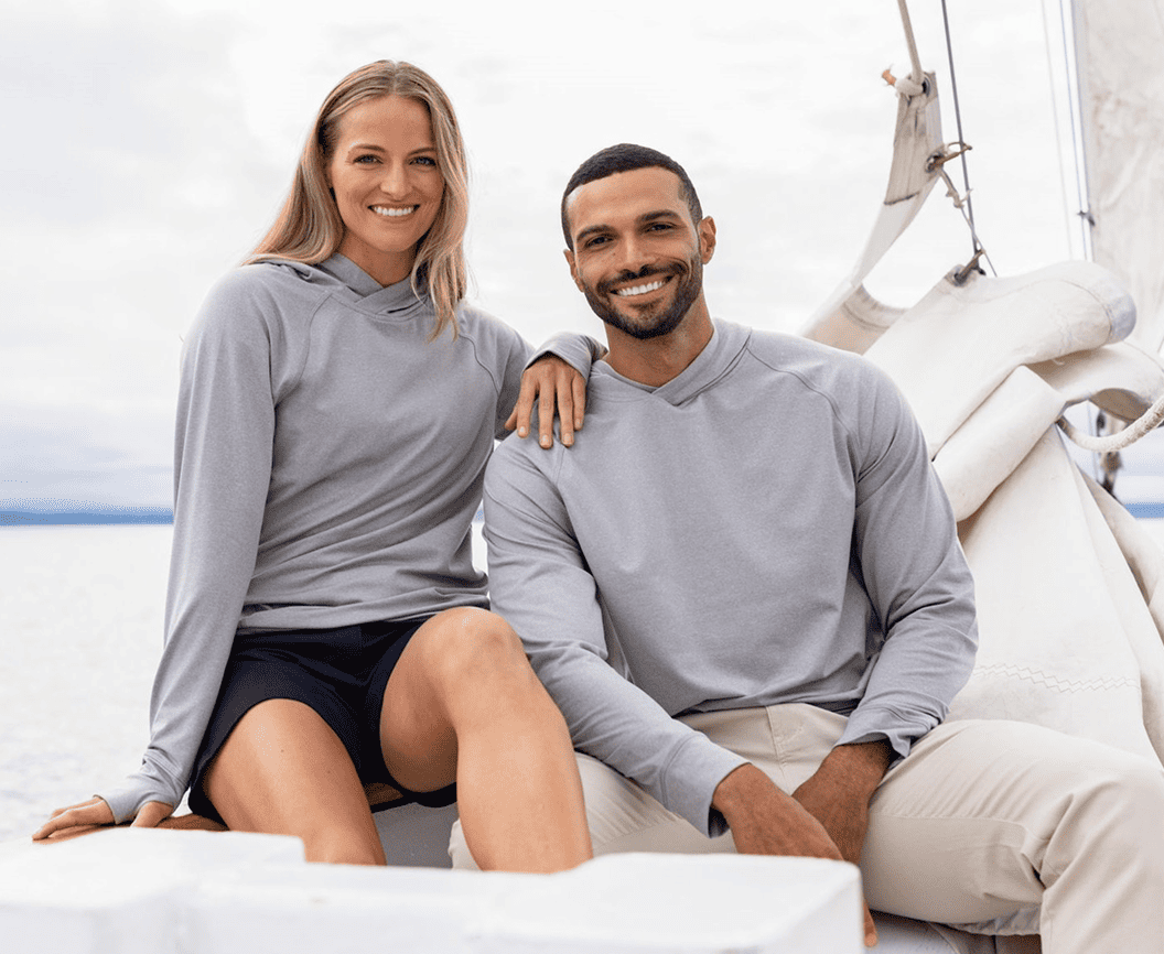 Man and Woman in Gray Adapt Cutter & Buck Hooded Sweatshirts