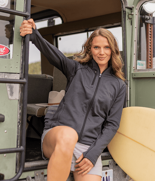 Woman wearing full zip gray cutter & Buck jacket