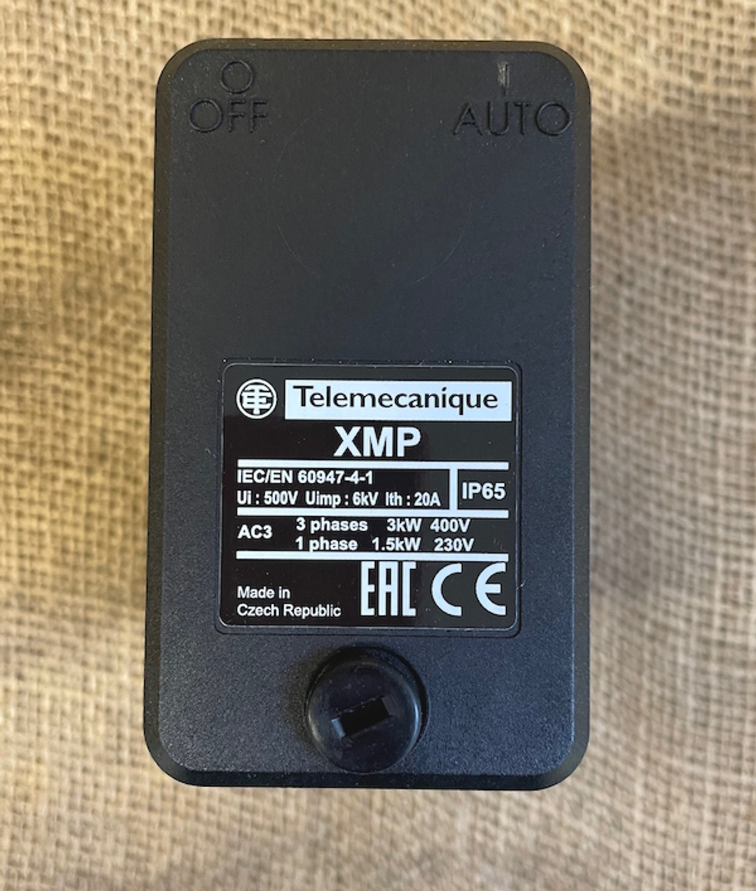 Side view of the Telemecanique XMPA12B21442 pressure switch showing the top of the cover.