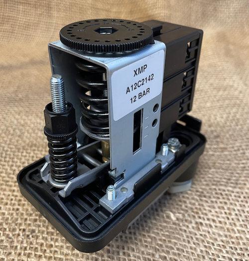 Telemecanique XMPA12C2142 3 screw terminals on each side with cover off and 3D front view showing big adjusting wheel on the top and the smaller differential adjustment on the end.