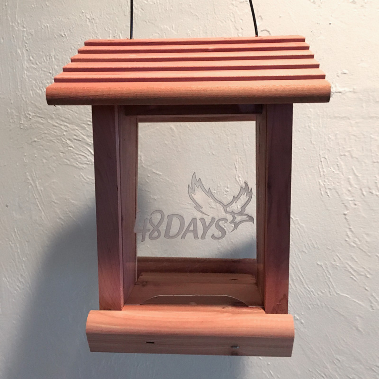 https://cdn11.bigcommerce.com/s-d22a0/images/stencil/1280x1280/products/2393/10960/bird-feeder-logo-engraved-2-small__35700.1577465576.jpg?c=2