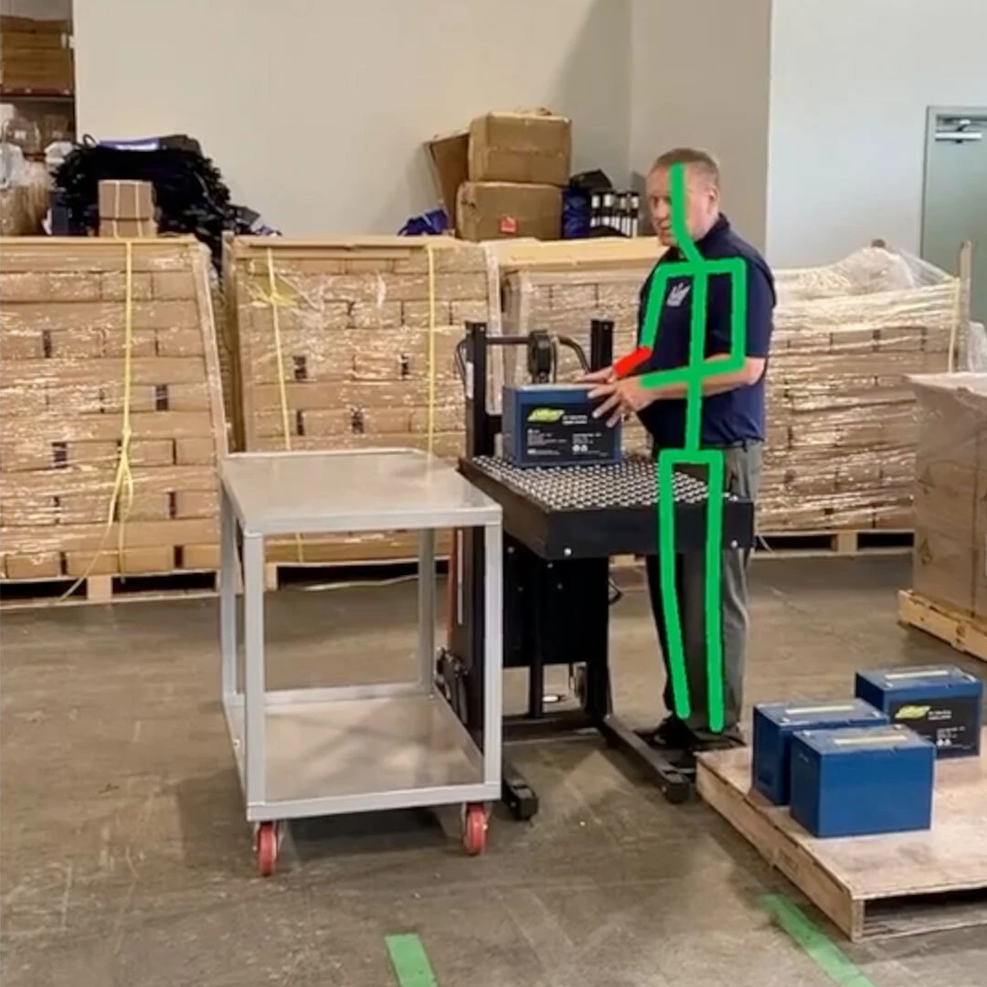 Worker performing a material handling task assessed in a Ballymore ergonomic safety evaluation