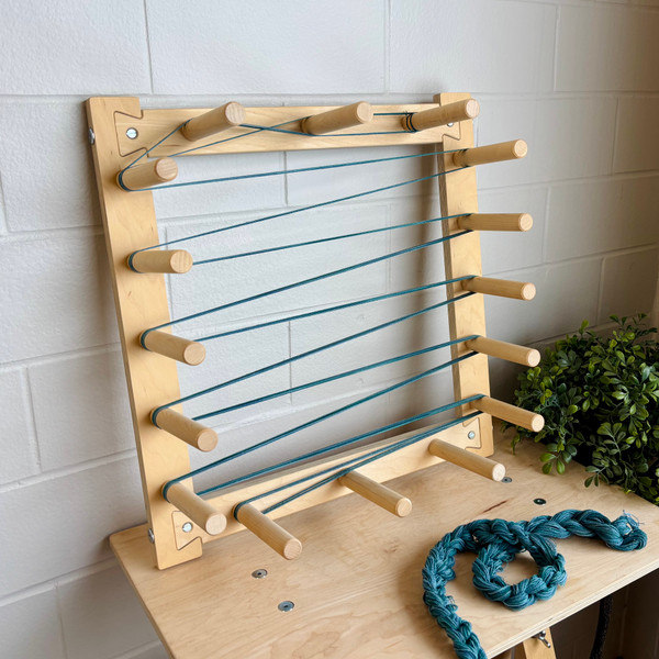 4.5 Yard Warping Board by Fiber Artist Supply Co., handcrafted from durable hard maple and designed for accurately measuring warp yarn for weaving projects. This wooden warping board allows fiber artists to efficiently create consistent warp lengths up to 4.5 yards, featuring sturdy pegs and smooth construction for reliable performance.