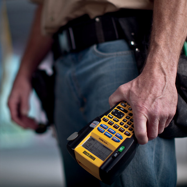 DYMO Rhino 5200 industrial label maker held in hand