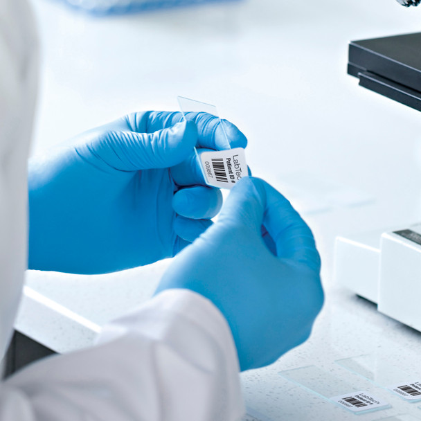 Blue gloves in laboratory with barcode style label attached