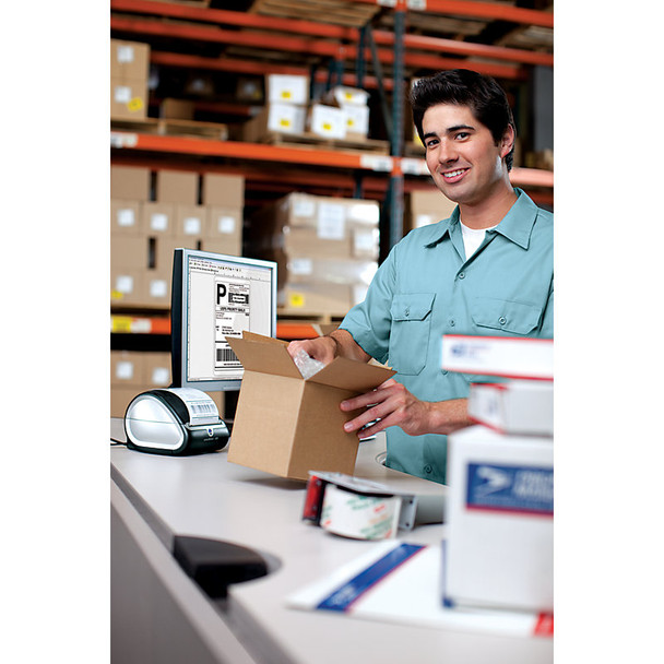 Busy packing station using Dymo shipping labels for parcel dispatch