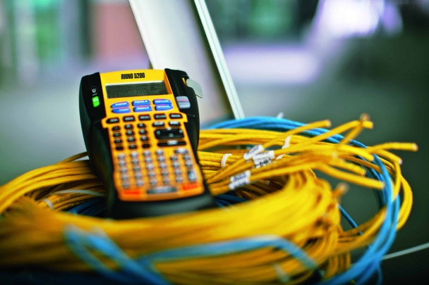 Dymo Rhino label maker with labelled cables for industrial wire marking
