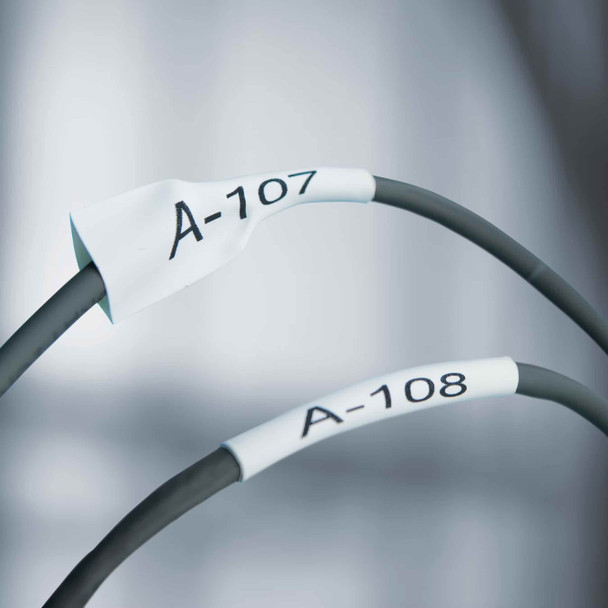 Printed heat shrink tube labels fitted onto electrical wires