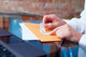 Printed DYMO address labels applied to rolled documents and mailing sheets in an office filing environment