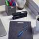 Label maker beside stationery and office desk accessories