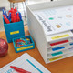 Organised desk and stationery items labelled with yellow LetraTag plastic tape
