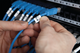 Cable identification labels being applied to bundled wires
