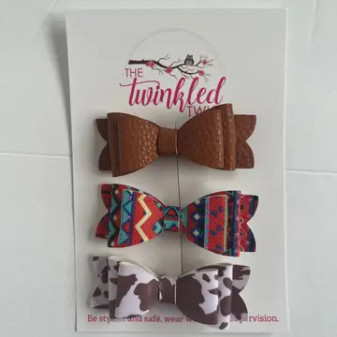 BROWN AZTEC COW BOWS