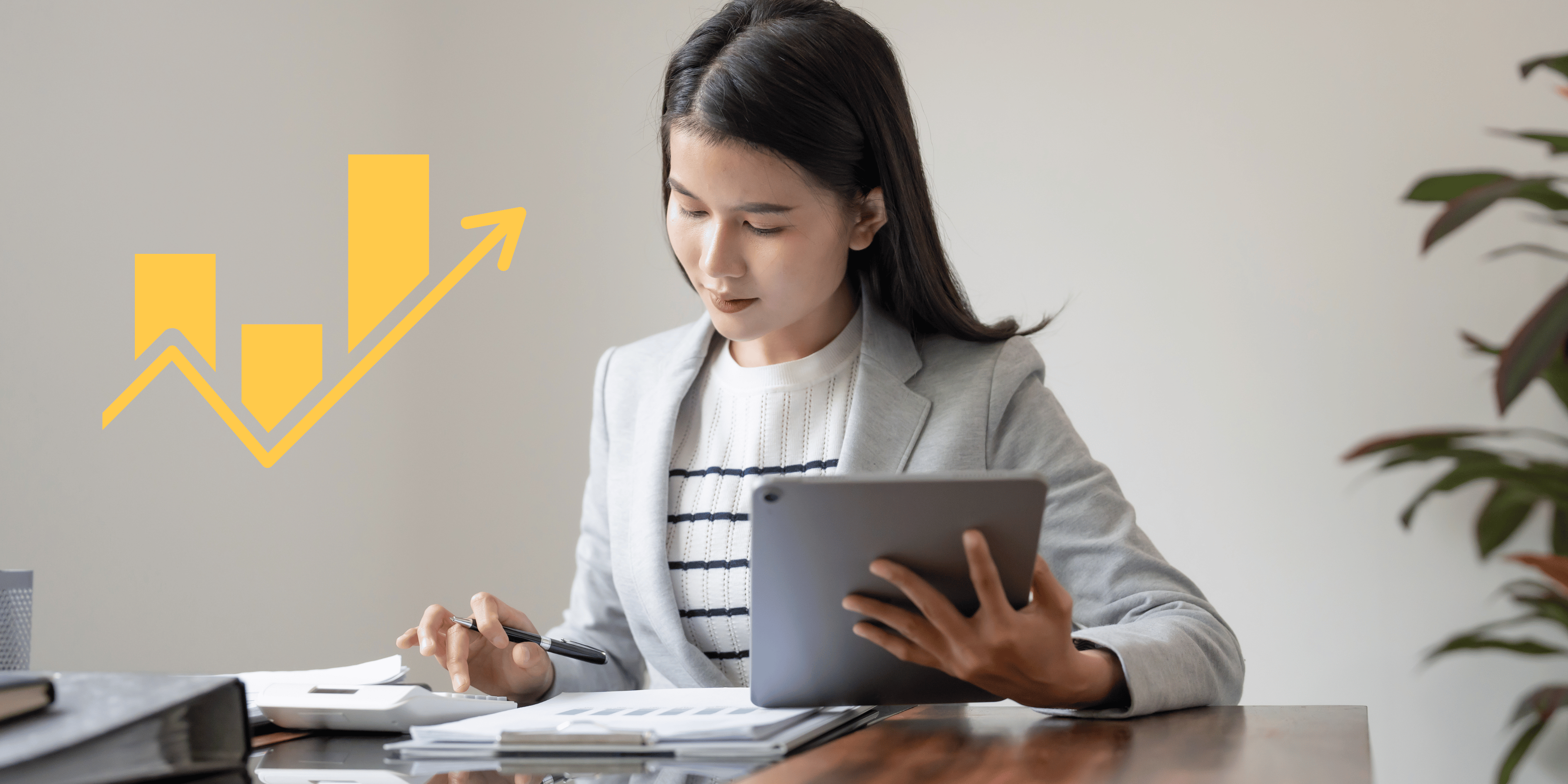 Professional reviewing business growth and financial analysis on a tablet