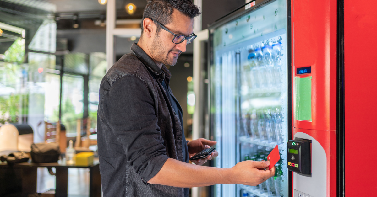 Customer using cashless payment at a modern non-traditional vending machine