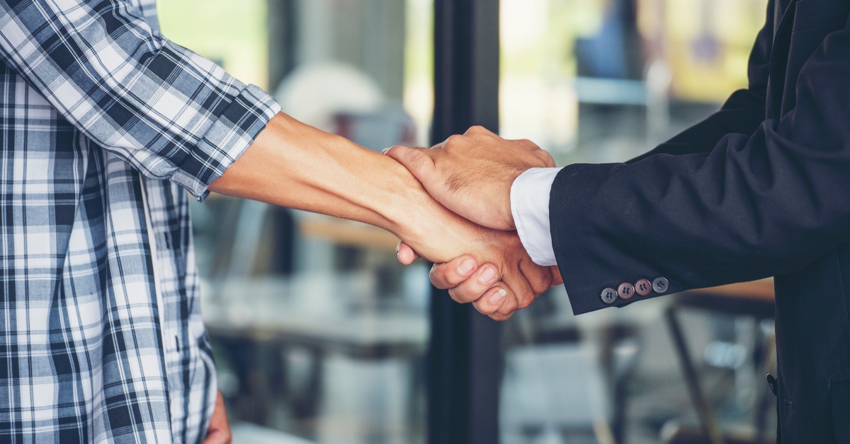 Business handshake representing trusted customer support and long-term vending business partnerships.