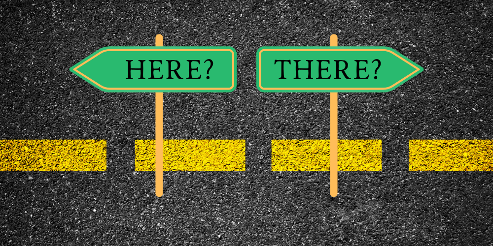 Here and there directional road signs showing decision-making paths