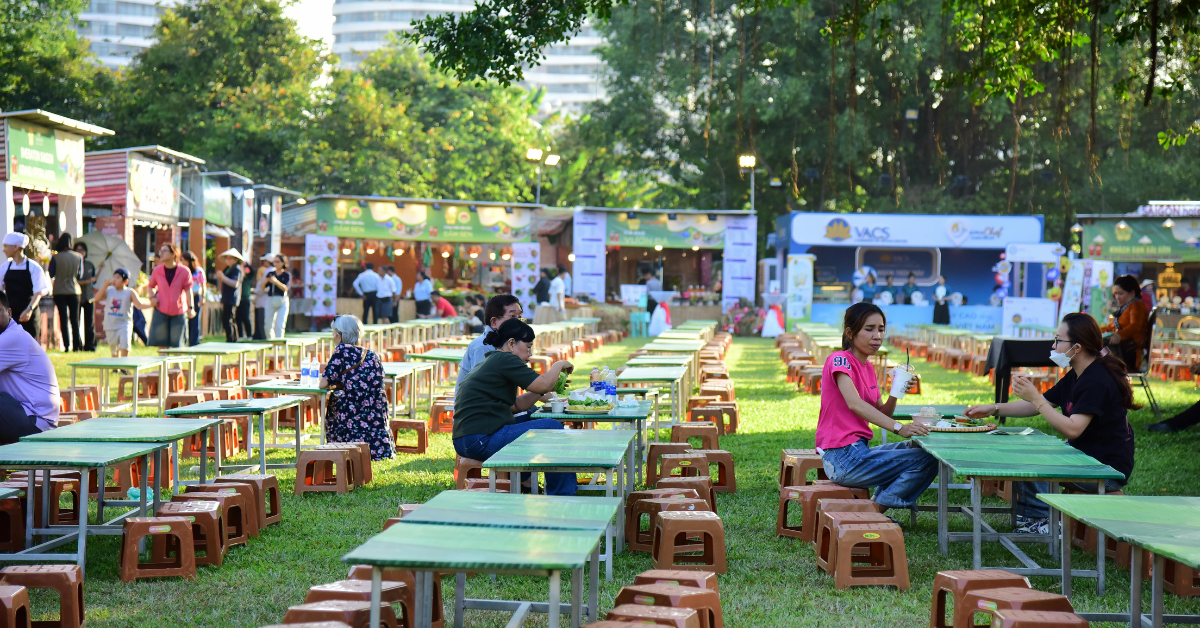 Outdoor dining area with multiple food vendors, illustrating nearby food competition that can affect vending machine performance.