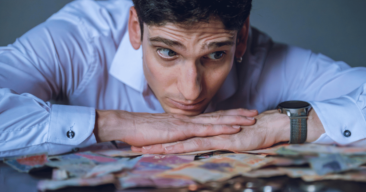Stressed vending operator reviewing cash flow and expenses.