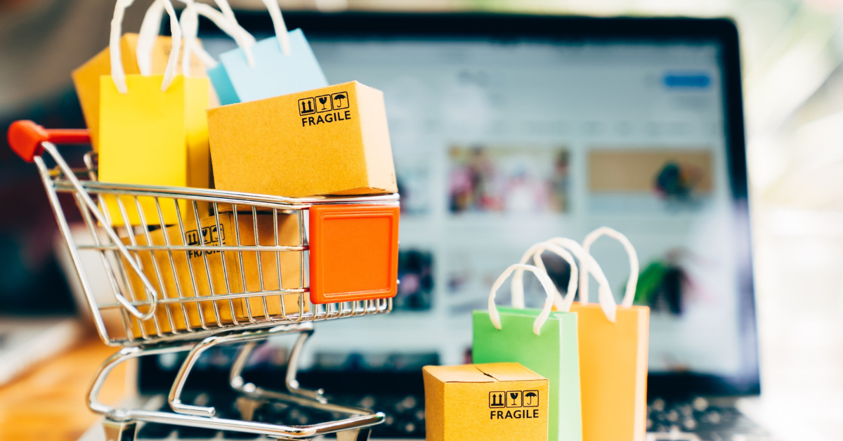 Shopping cart with packages representing online marketplace inventory sourcing for vending machine products