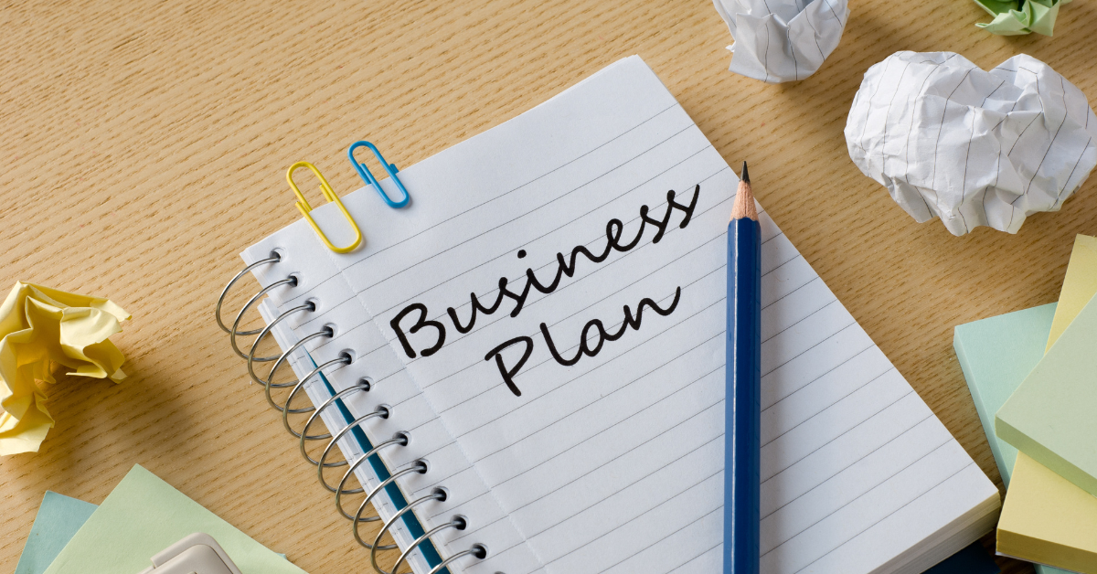 Notebook with business plan notes for building a profitable vending route