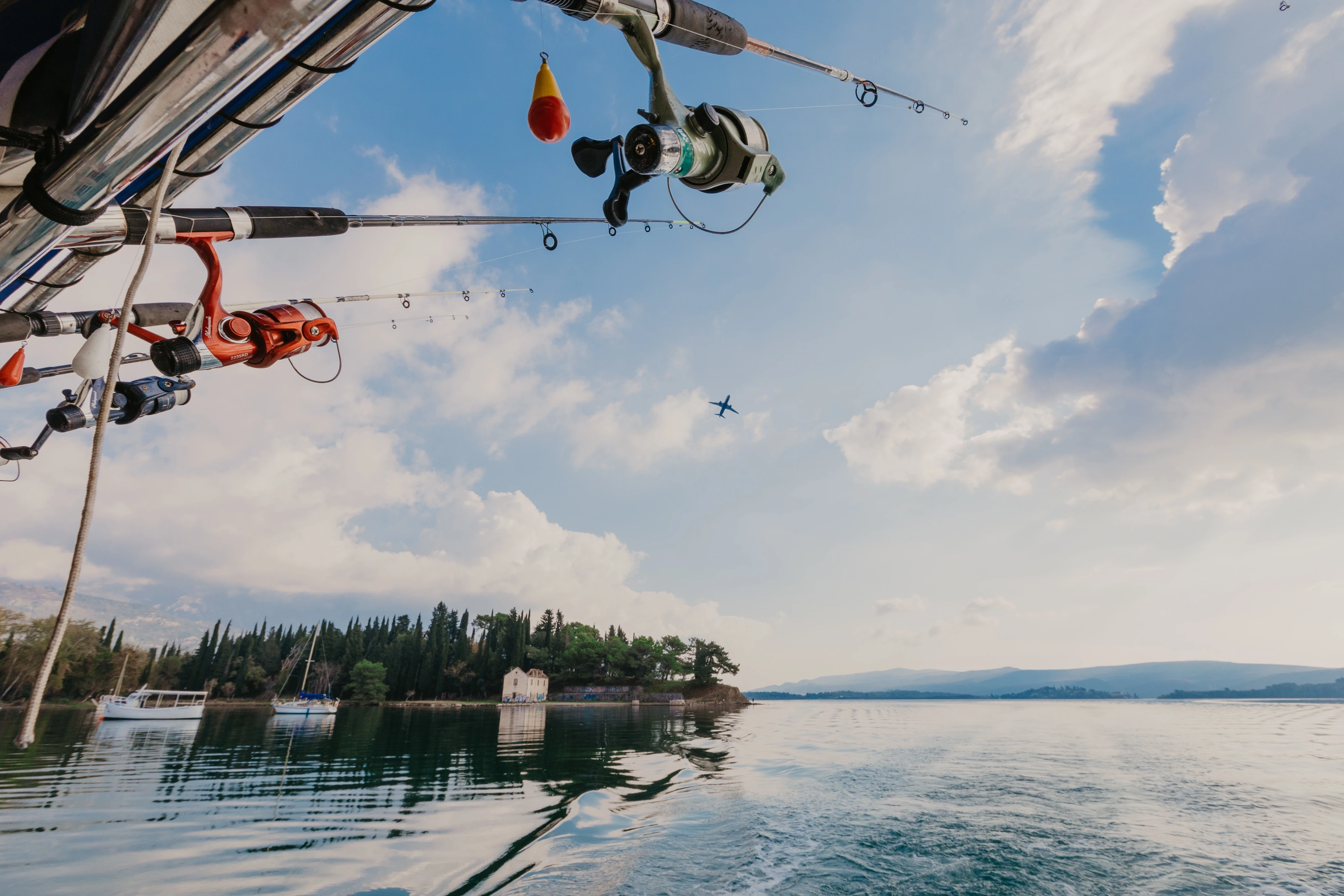 Fishing rods held in rod holders on a boat