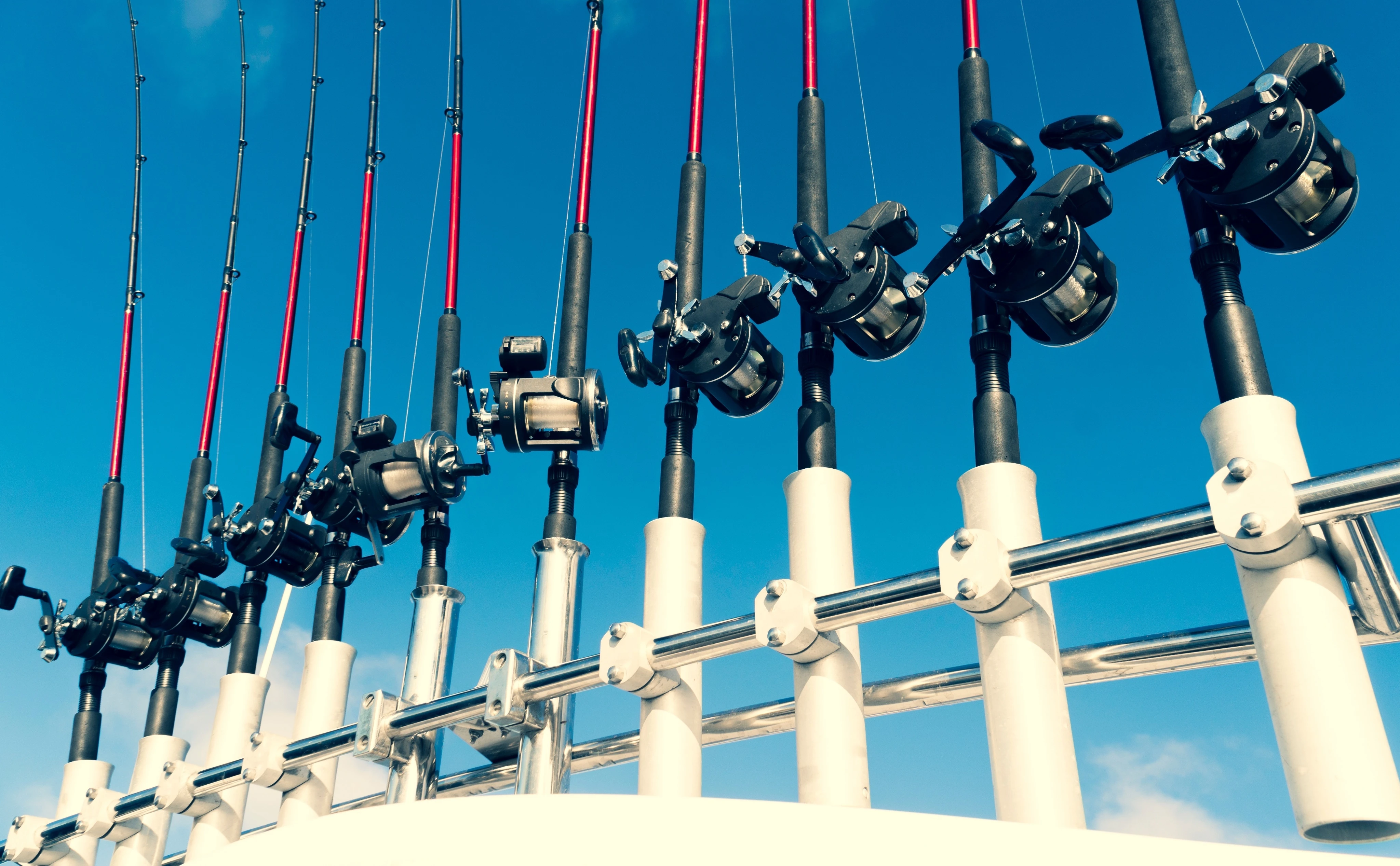 Trolling rods seated in rod holders on deck