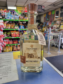 Cazcanes Nuestras Raíces Agave Spirit is a bold, unclassified agave expression that honors traditional production methods and ancestral roots. Crafted by the award-winning Cazcanes team using 100% blue Weber agave, this 750ml bottle delivers an earthy, complex, and terroir-driven spirit that bridges the gap between tequila and mezcal. Raw, authentic, and full of character, it's a must-try for agave purists and craft spirits lovers.
