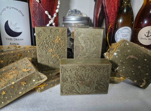 These handcrafted Luck Attraction Hoodoo body soap bars are specially formulated with a blend of organic roots, potent herbs, and natural oils, each chosen for its powerful properties in drawing positive energies and enhancing personal luck. Infused with traditional Hoodoo ingredients these soaps help cleanse both body and spirit, inviting the vibrations of luck into your life. Free from synthetic additives, these soaps nourish the skin while imbuing it with protective and luck-attracting vibrations. Perfect for daily rituals or as part of your spiritual practices, each bar is crafted with intention to help you manifest the luck and blessings you seek.
