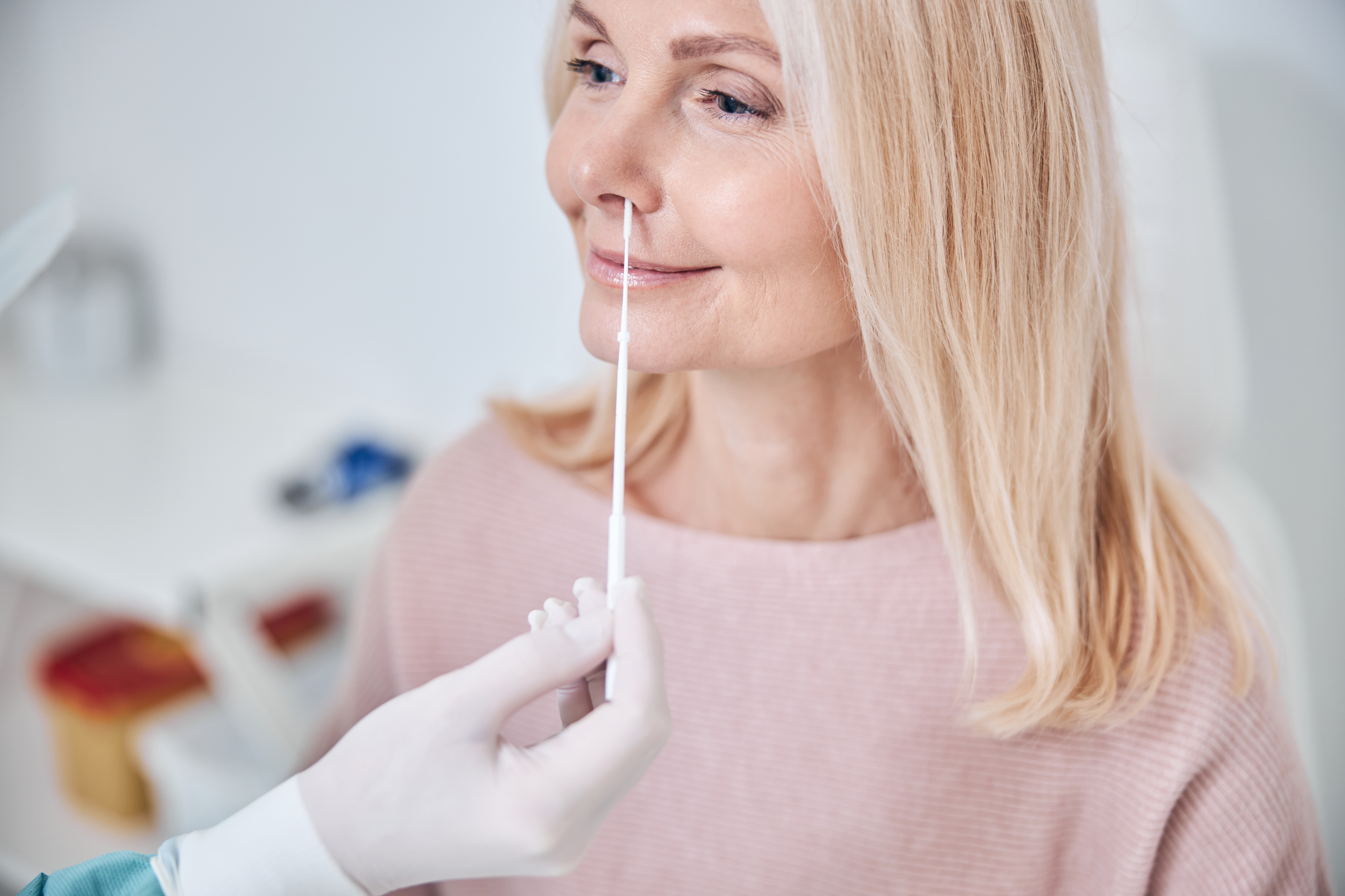 smiling-female-patient-undergoing-a-medical-proced-2021-09-03-09-42-28-utc.jpg