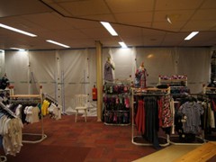 Protect retail merchandise during store renovation or installing new marketing displays with the Curtain-Wall® temporary wall system.