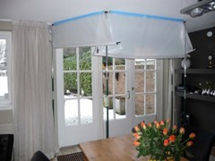 Keep heat in and cold out (or vice versa) during window and door replacement with the Curtain-Wall® temporary wall system.