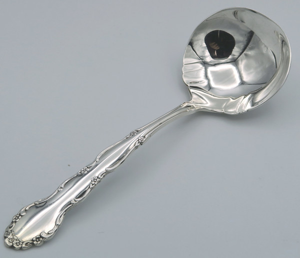 Flirtation by 1881 Rogers gravy ladle