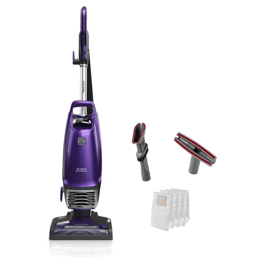 Upright vacuum and accessories on a white background
