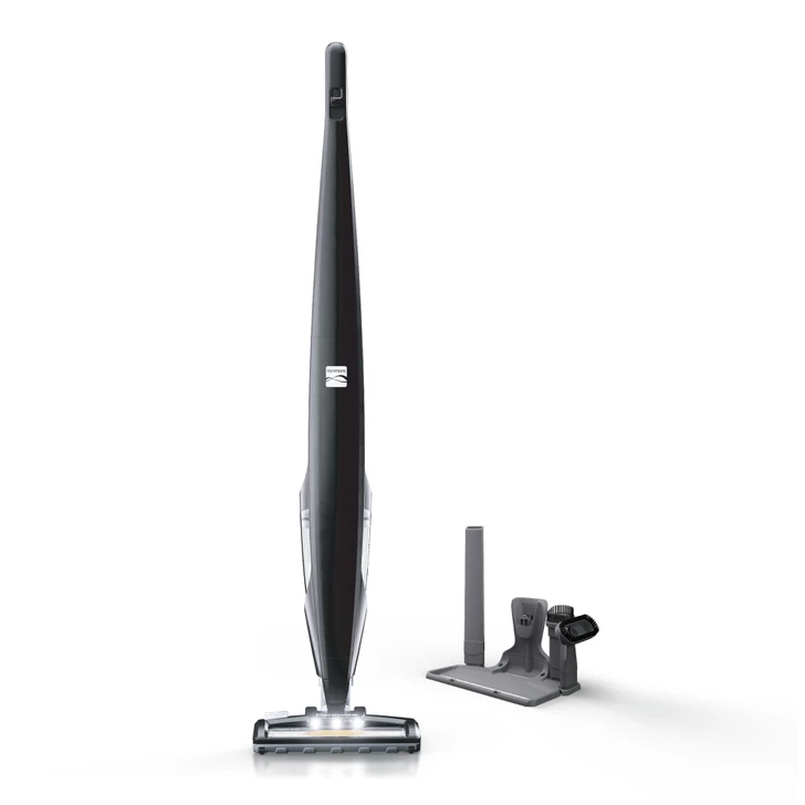 Stick vac with charging base and accessories on a white background