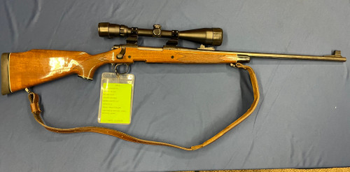 USED REMINGTON 700 DM 300 MAG, 24" BBL, WALNUT/BLUED 15674