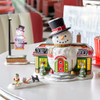 After a long day of building toys, Santa and his elves love to stop at Snowy's Diner. Built from a vintage train dining car, the campy snowman design sets the causal vibe of the atmosphere inside. Set of 2 includes roadside sign.